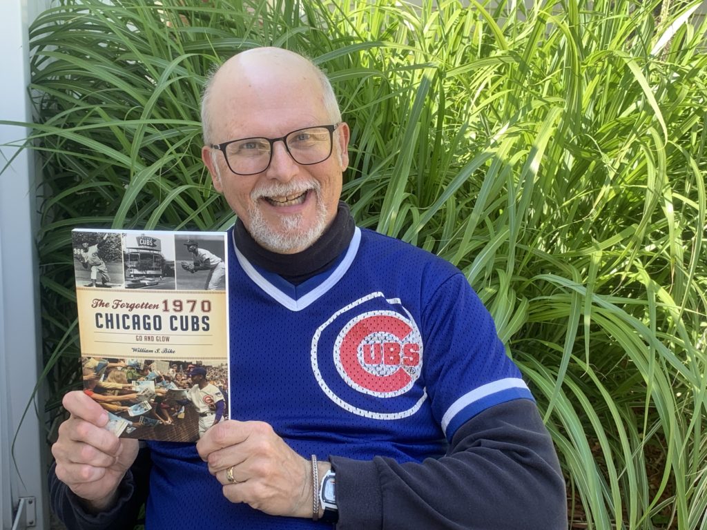 1970 Chicago Cubs book - author William S Bike with book, outside in sunshine